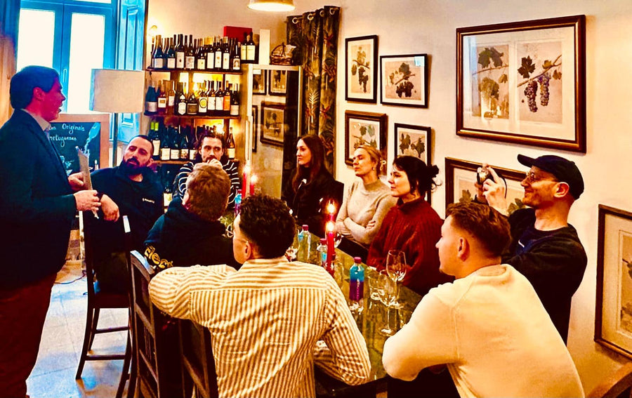 Guests at a candlelit Portuguese wine tasting at POP in Graça, Lisbon