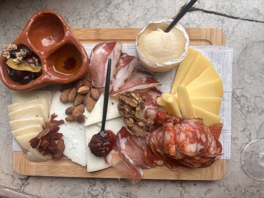 Cheese and charcuterie board served with Portuguese wine at POP, Lisbon